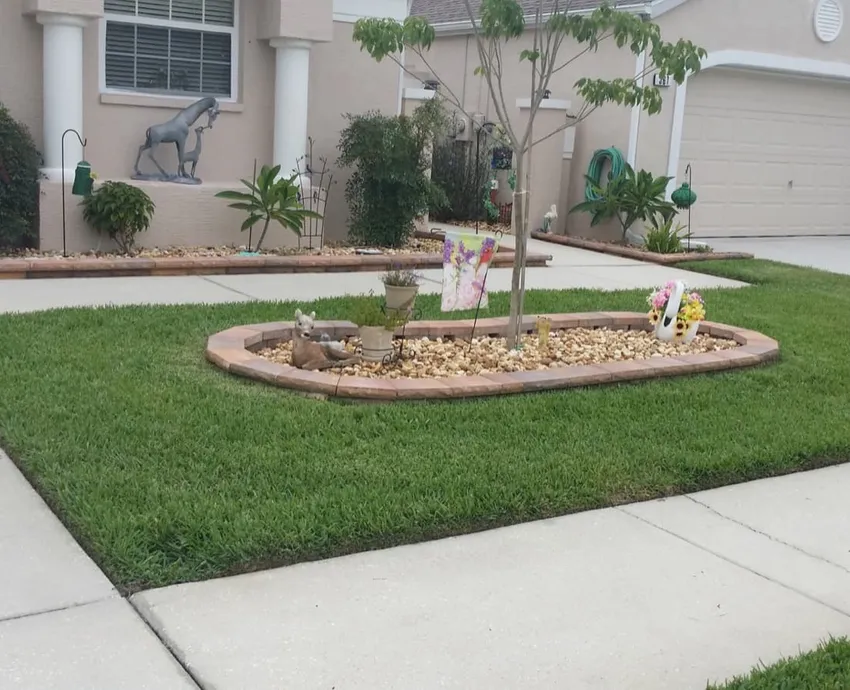 Artificial turf lawn installed beside a Florida home