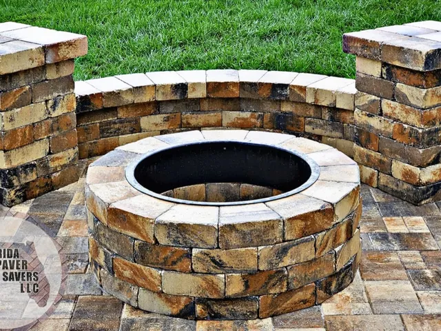 Custom masonry fire pit with a curved seating wall