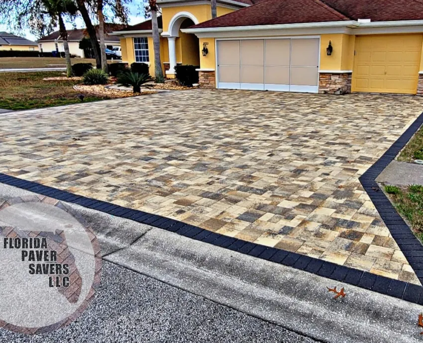 Installed paver driveway with a dark contrasting border in Florida